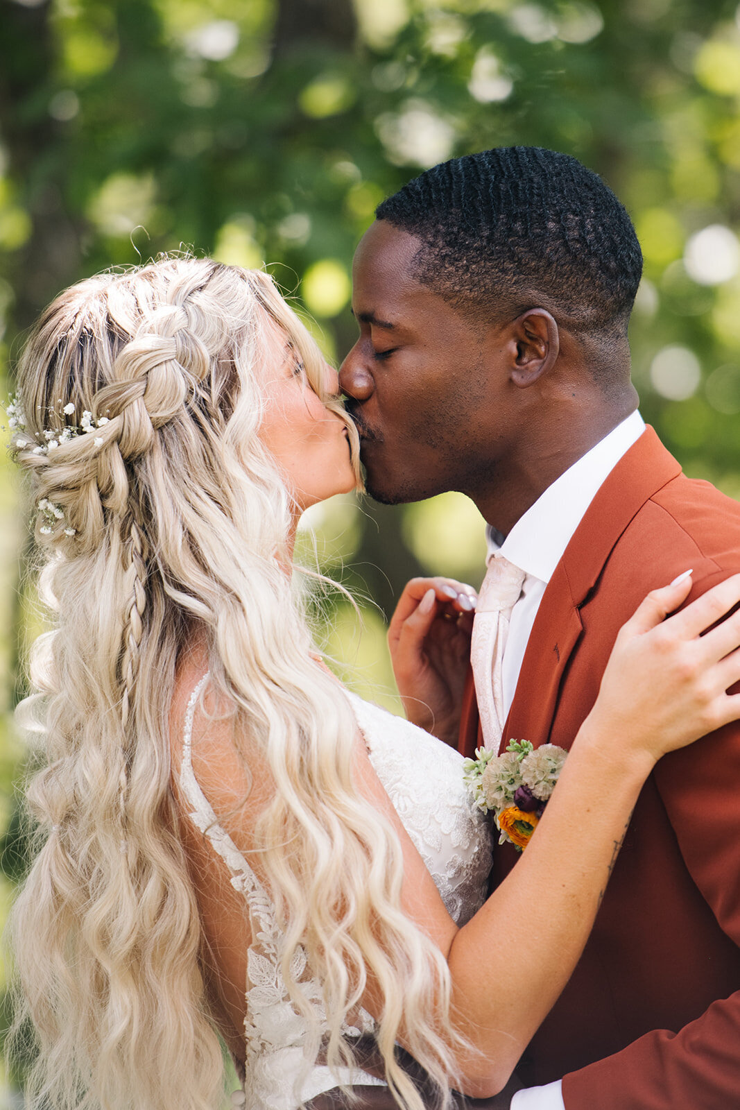 Bride and groom exchanging a joyful glance during their Denver wedding reception, photographed in a documentary style.