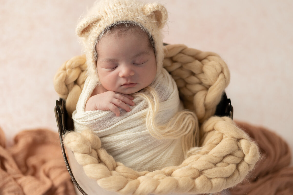 newborn bucket pose wrapped