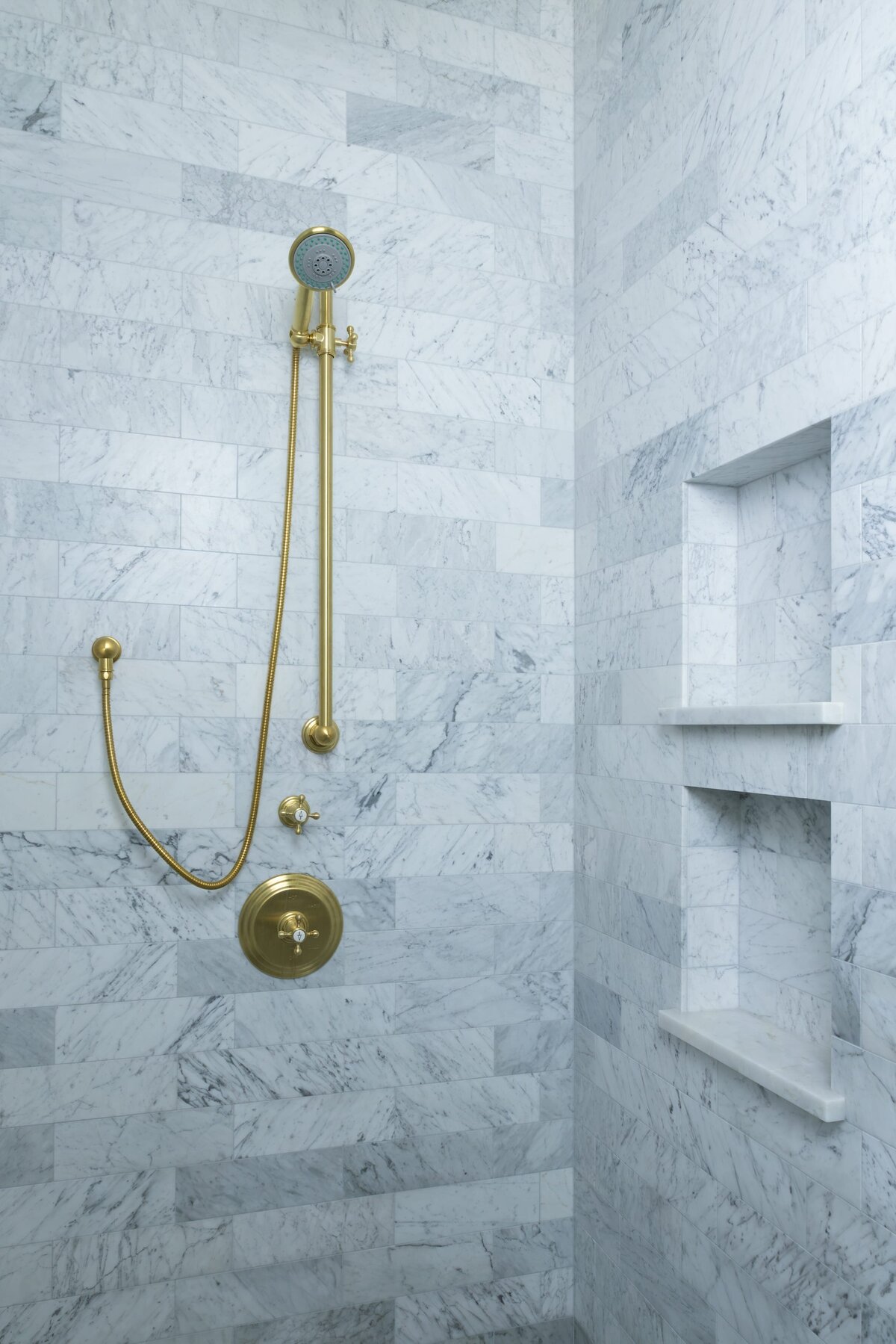 kyleen bushroe interiors coverdell shower tile with gold faucet