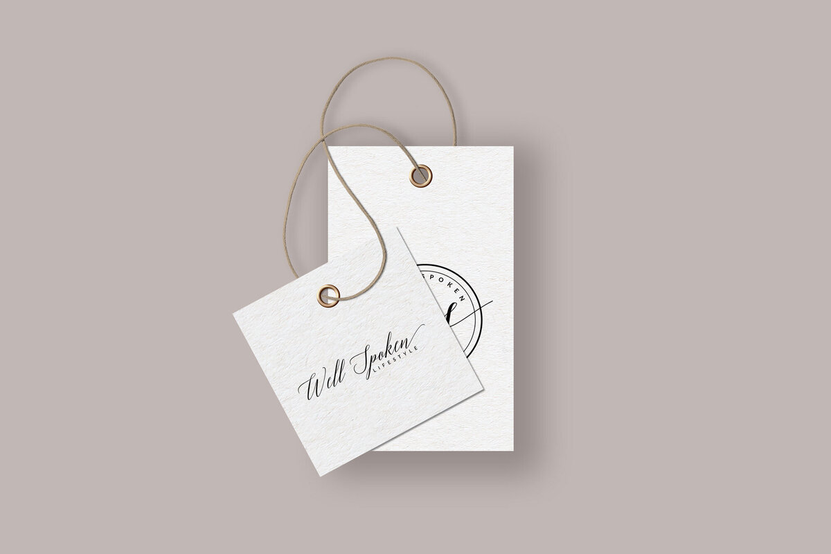 Experience the essence of luxury with Wellspoken Lifestyle's custom brand tag design. Crafted with precision, this tag reflects the sophisticated simplicity that the Wellspoken brand stands for. The textured paper and minimalist logo, coupled with an elegant typeface, convey an image of premium quality. Perfect for high-end lifestyle brands looking to make a statement, this tag design is a testament to The Agency's dedication to bespoke branding solutions. Enhance your product presentation and brand recognition with our expertly designed branding materials.