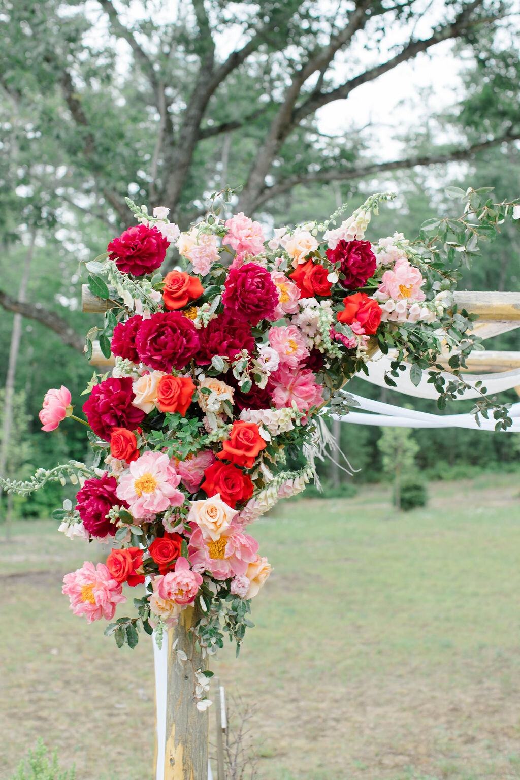 Colorful florals outside at Maine wedding