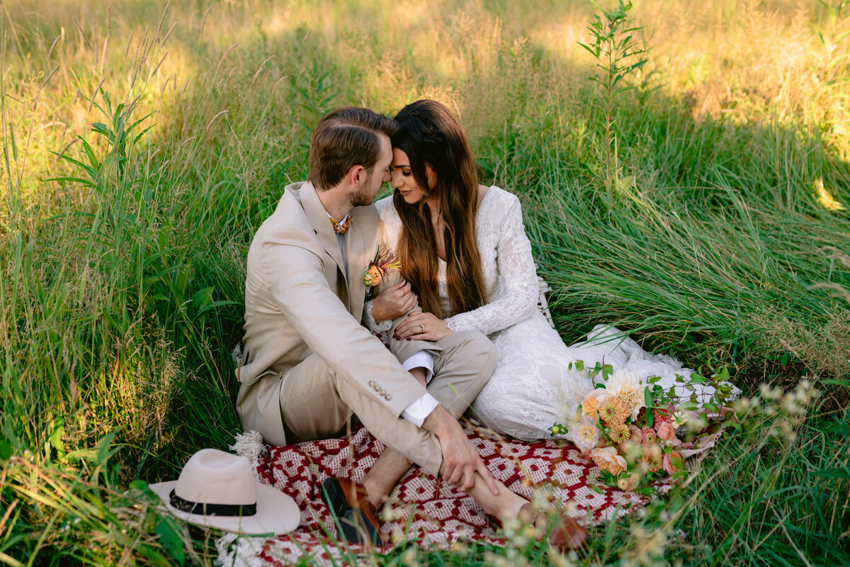 couple sitting in tall grass