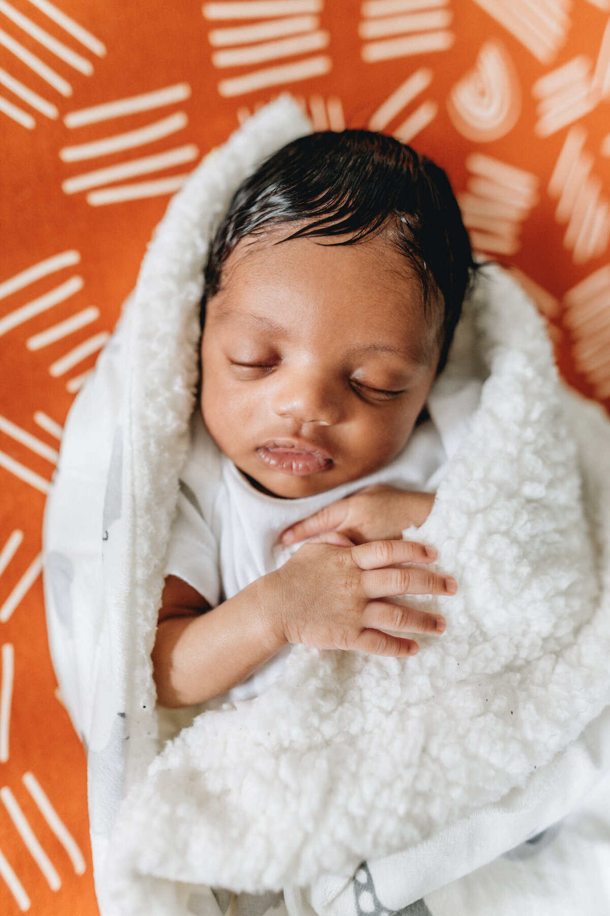 Infant baby sleeping in crib.
