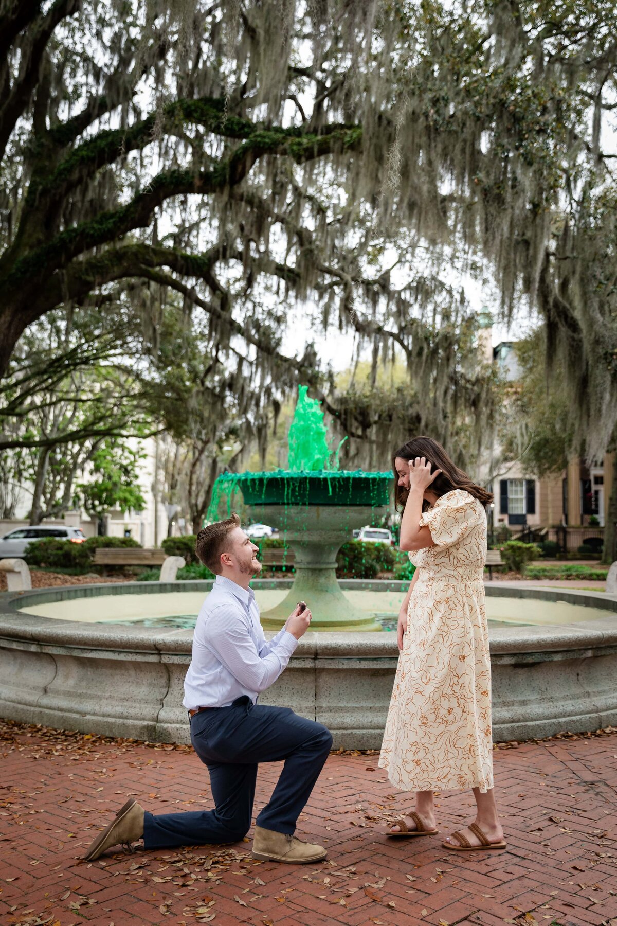 Proposing in front of Orleans Square, Savannah | Photo by Phavy Photography, Savannah Proposal Photographer