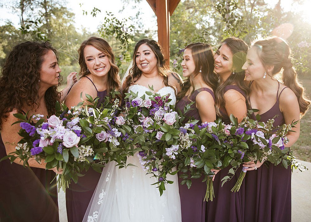 Purple Wedding with bridesmaids bouquets