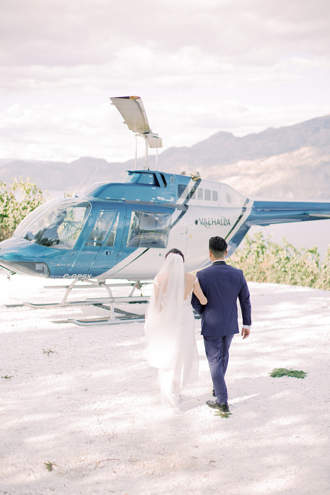 We planned an exciting wedding for this bride and groom where they took a helicopter tour for their wedding portraits.