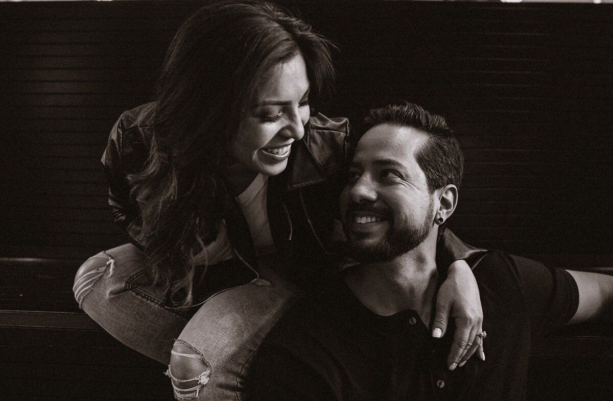 black and white photo of man and woman laughing