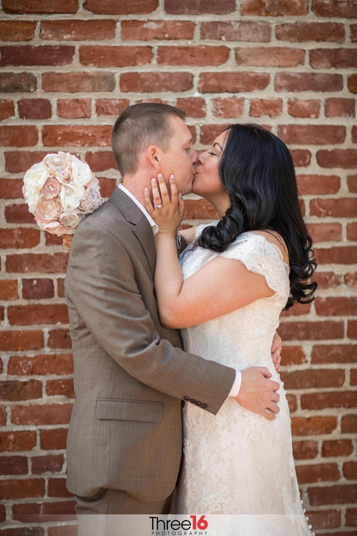 Bride and Groom share a sweet kiss after the ceremony when they have an alone moment together