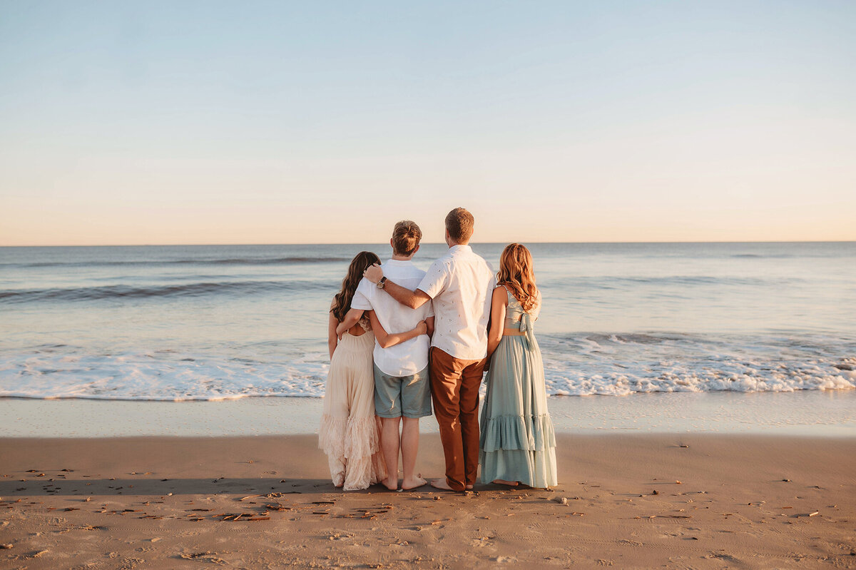 Family poses together for Beach Photoshoot in Isle of Palms.