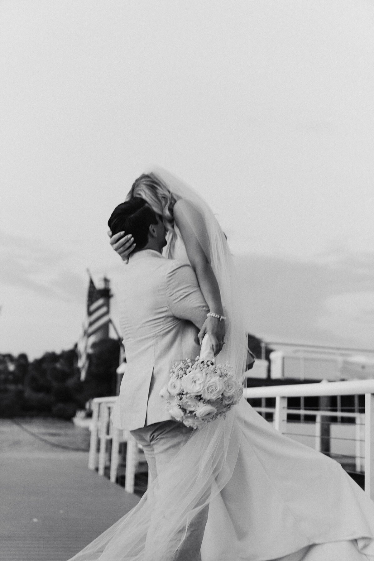 Bride and groom embracing taken by film wedding photographer