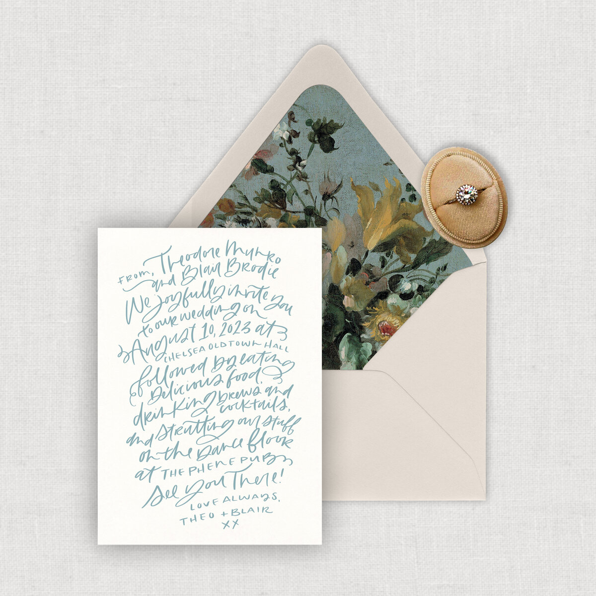 Handwritten calligraphy wedding invitation with printed envelope liner.