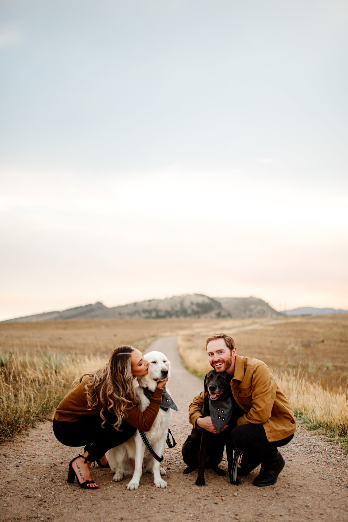 adorable couple with their two big dogs