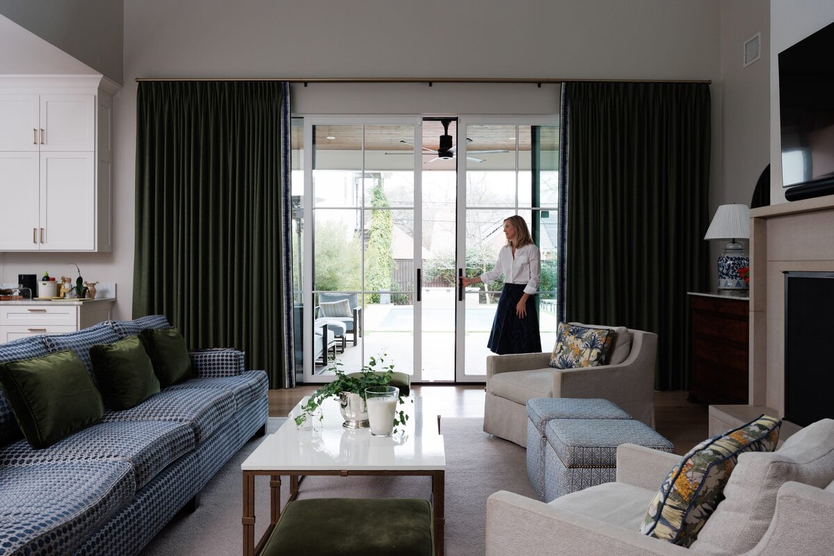 the keeping room interiors primera living room with large slding doors and white and gold coffee table