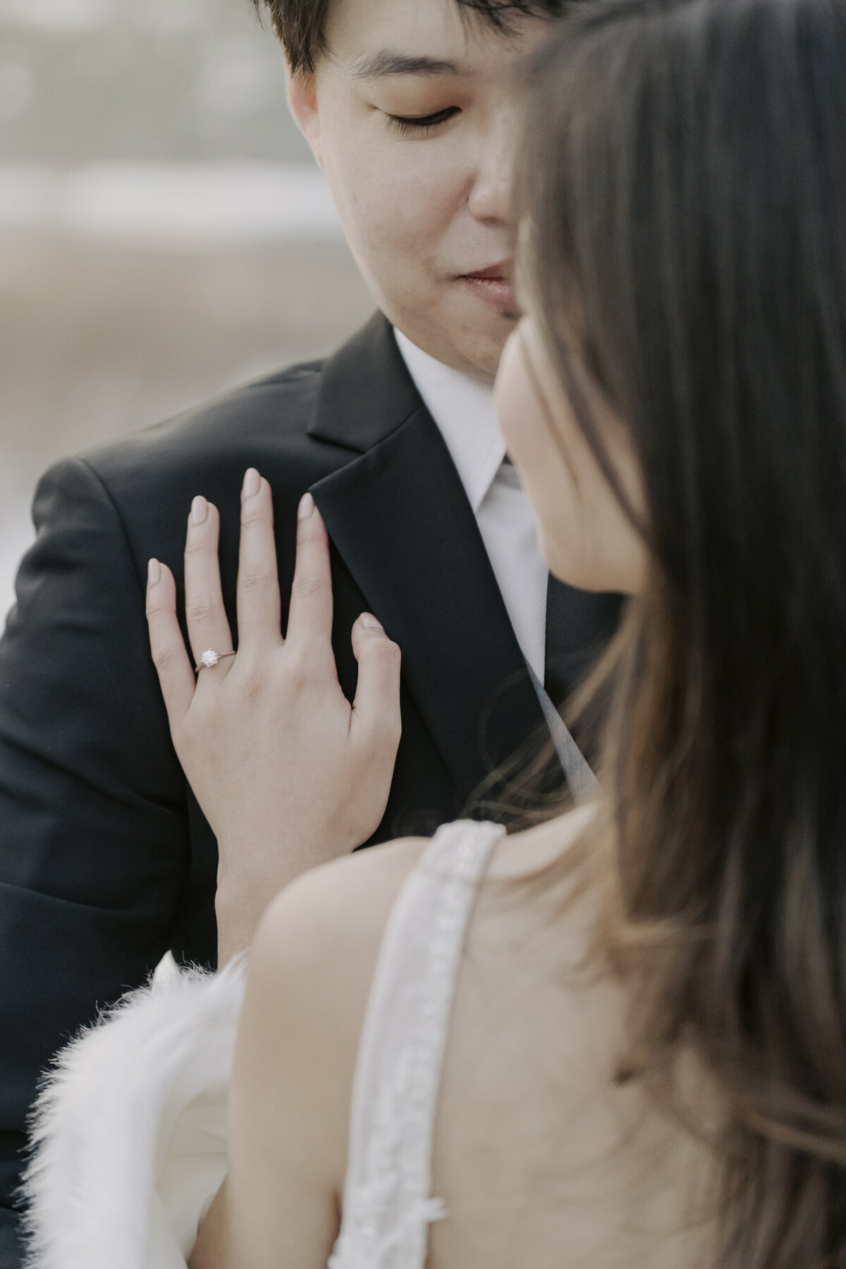 the bride put her hand on the groom's chest