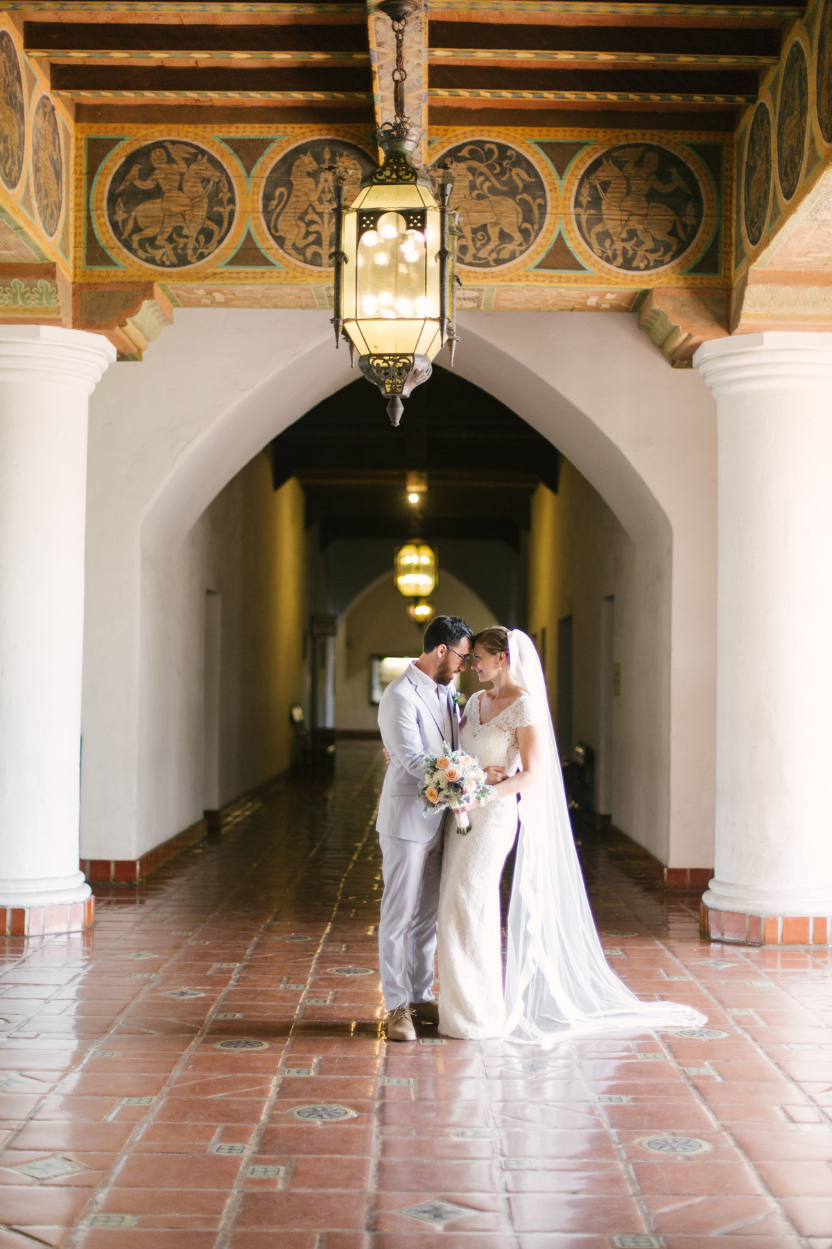 Bride and groom share a moment after Santa Barbara Courthouse wedding