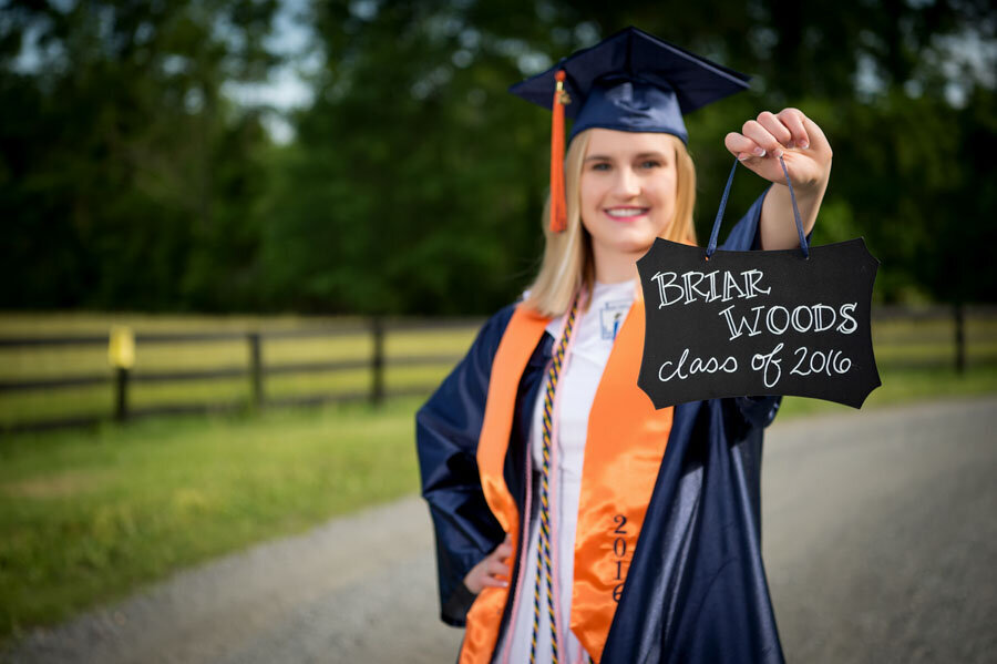 cap and gown senior in road