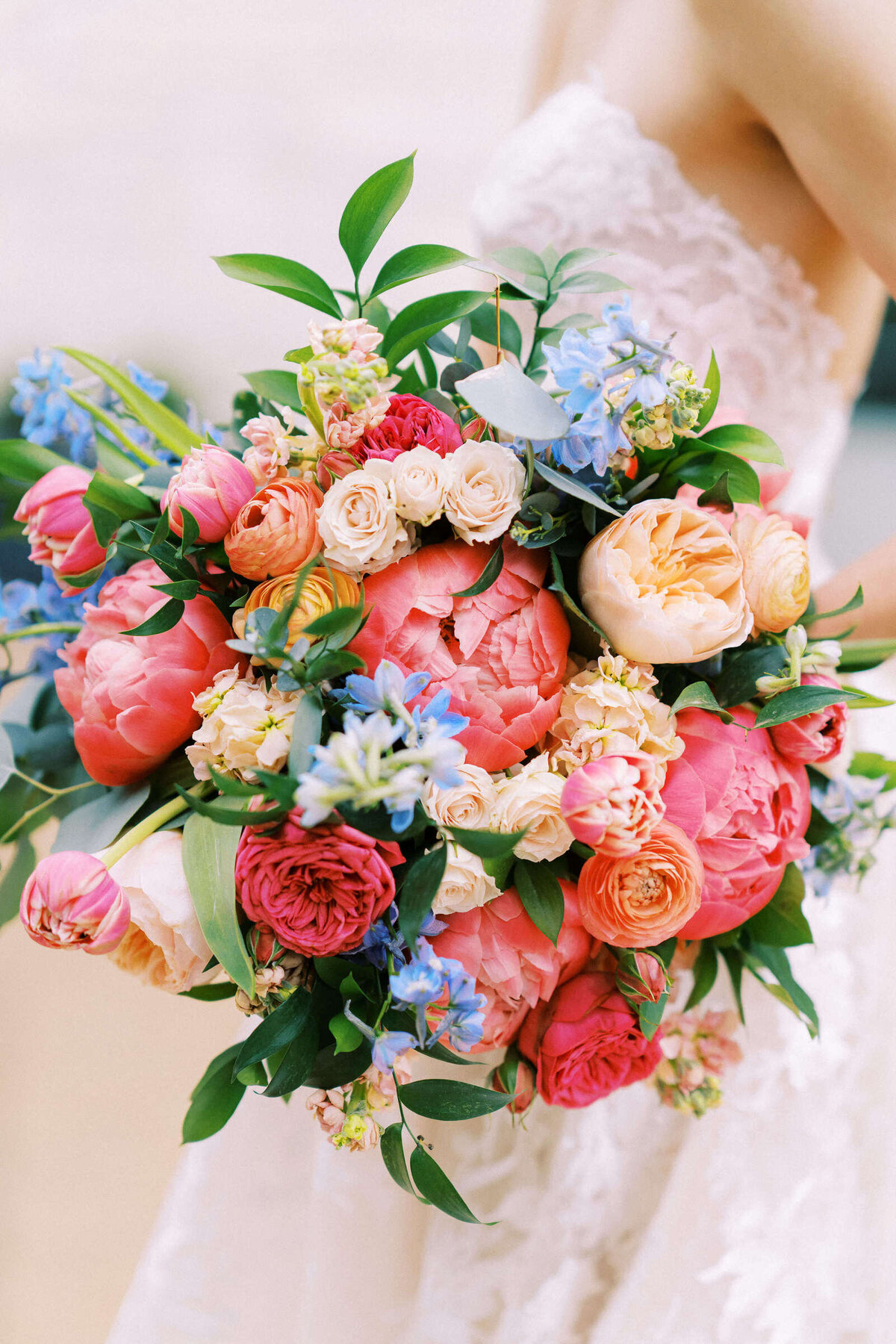 Rainbow bridal bouquet with peonies and roses