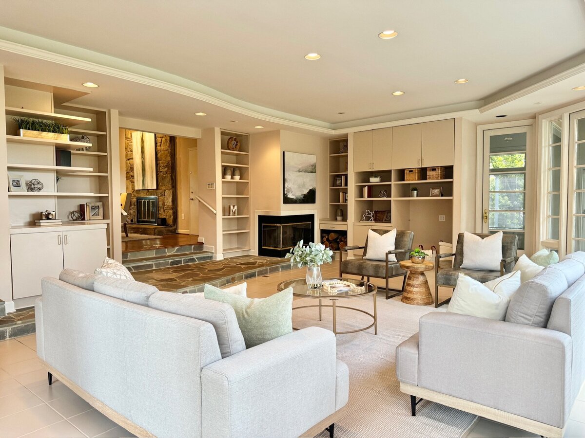 Living room with bookshelves and white accessories