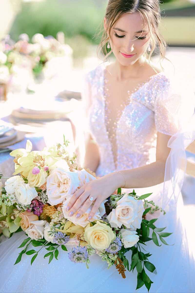 editorial bridal portrait of woman holding her wedding bouquet
