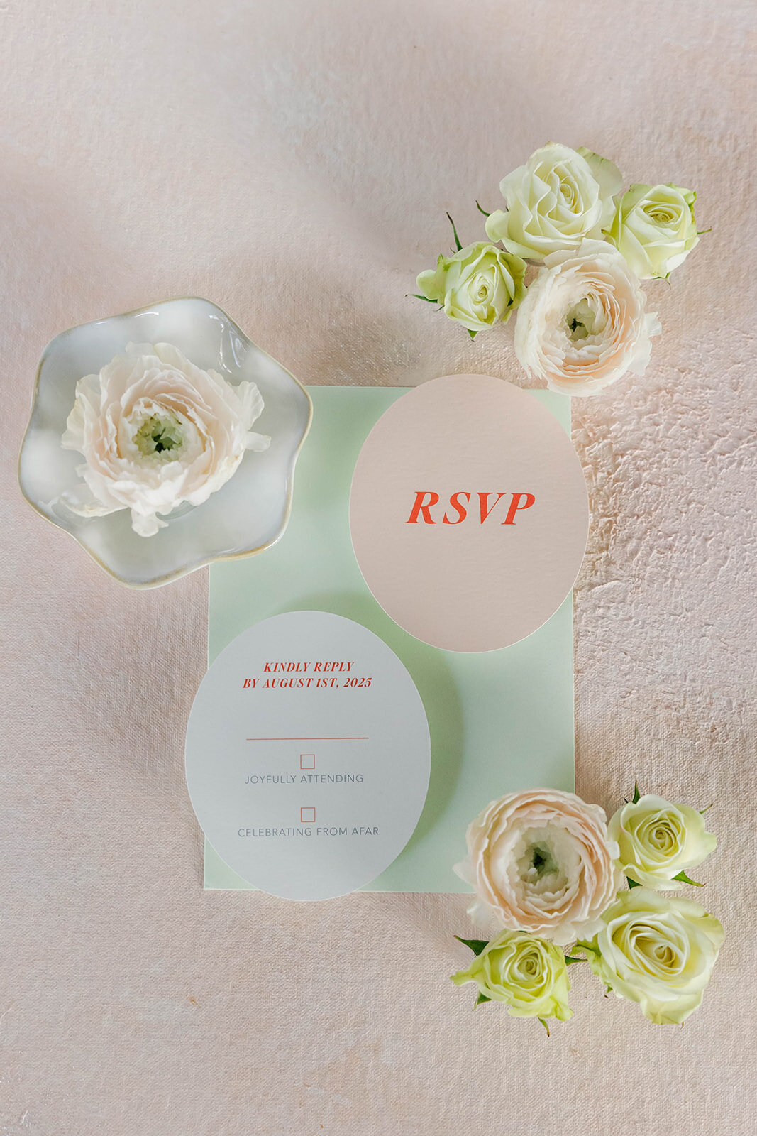 rsvp-card-and-details-card-styled-flatlay-with-florals