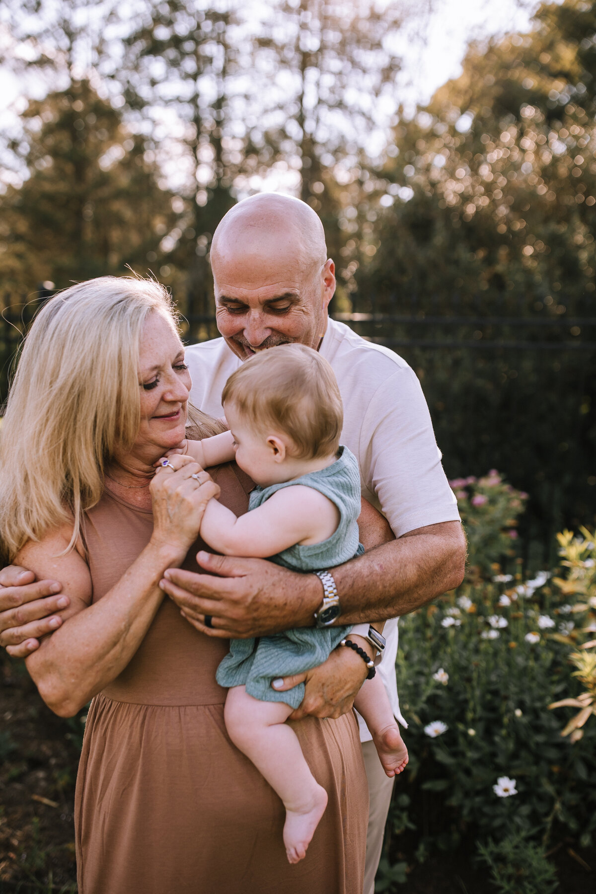Grandparents with their baby grandaughter's first birthday.