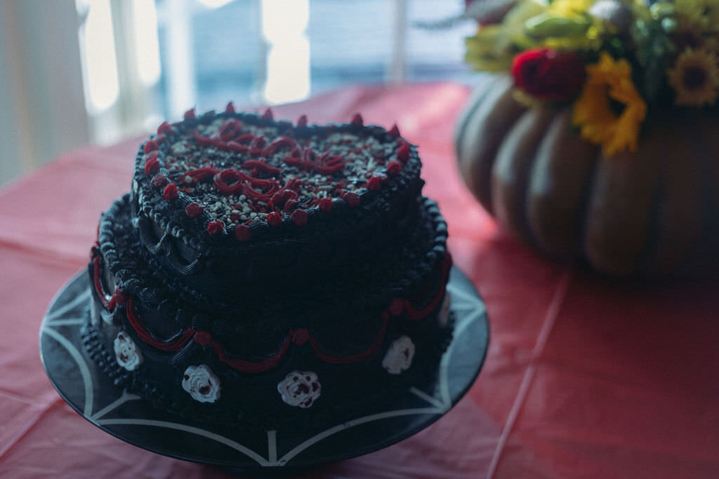 A black heart shaped wedding cake.