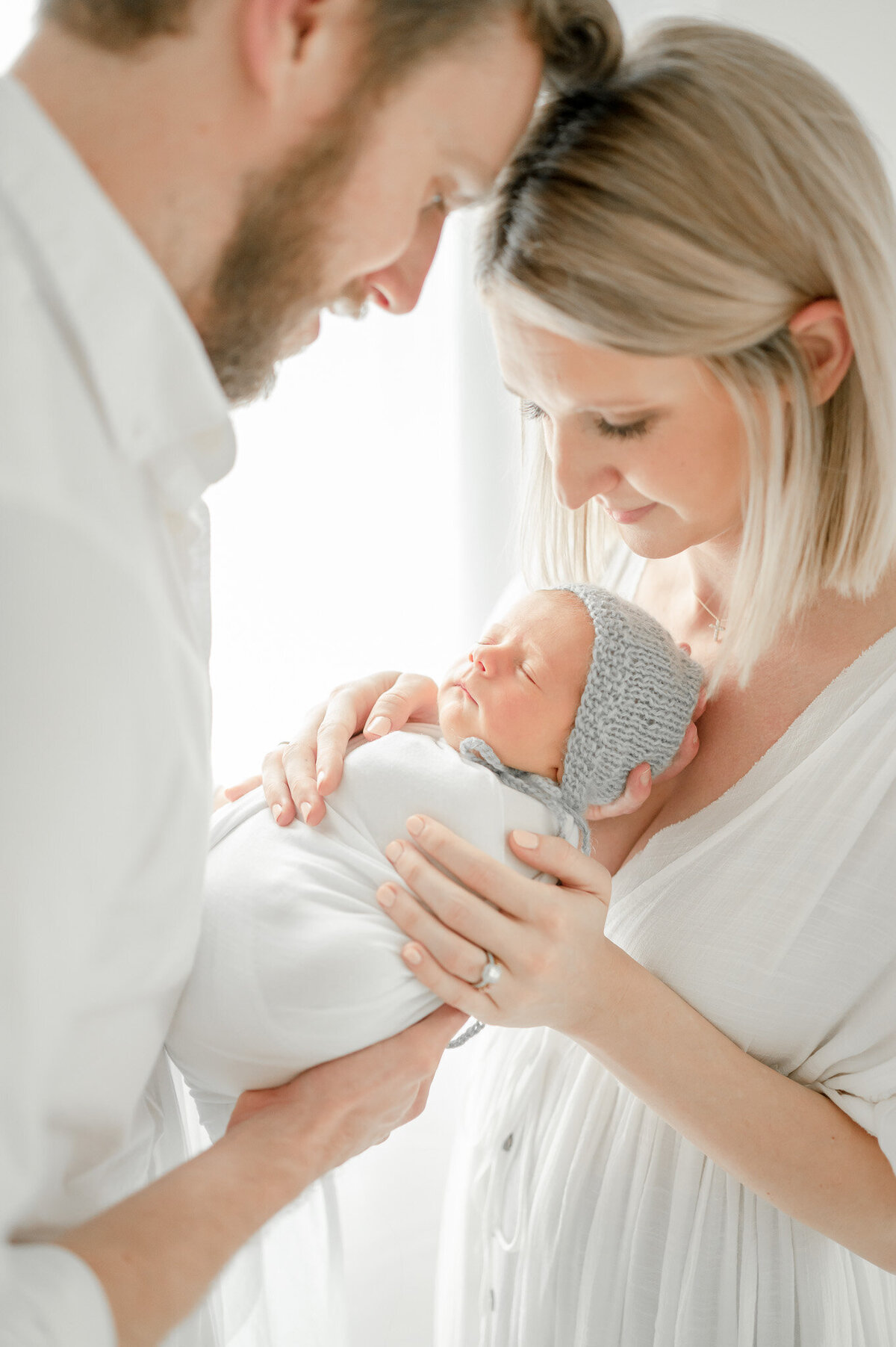 parents hold their newborn baby in Kristie Lloyd's nashville newborn photography studio