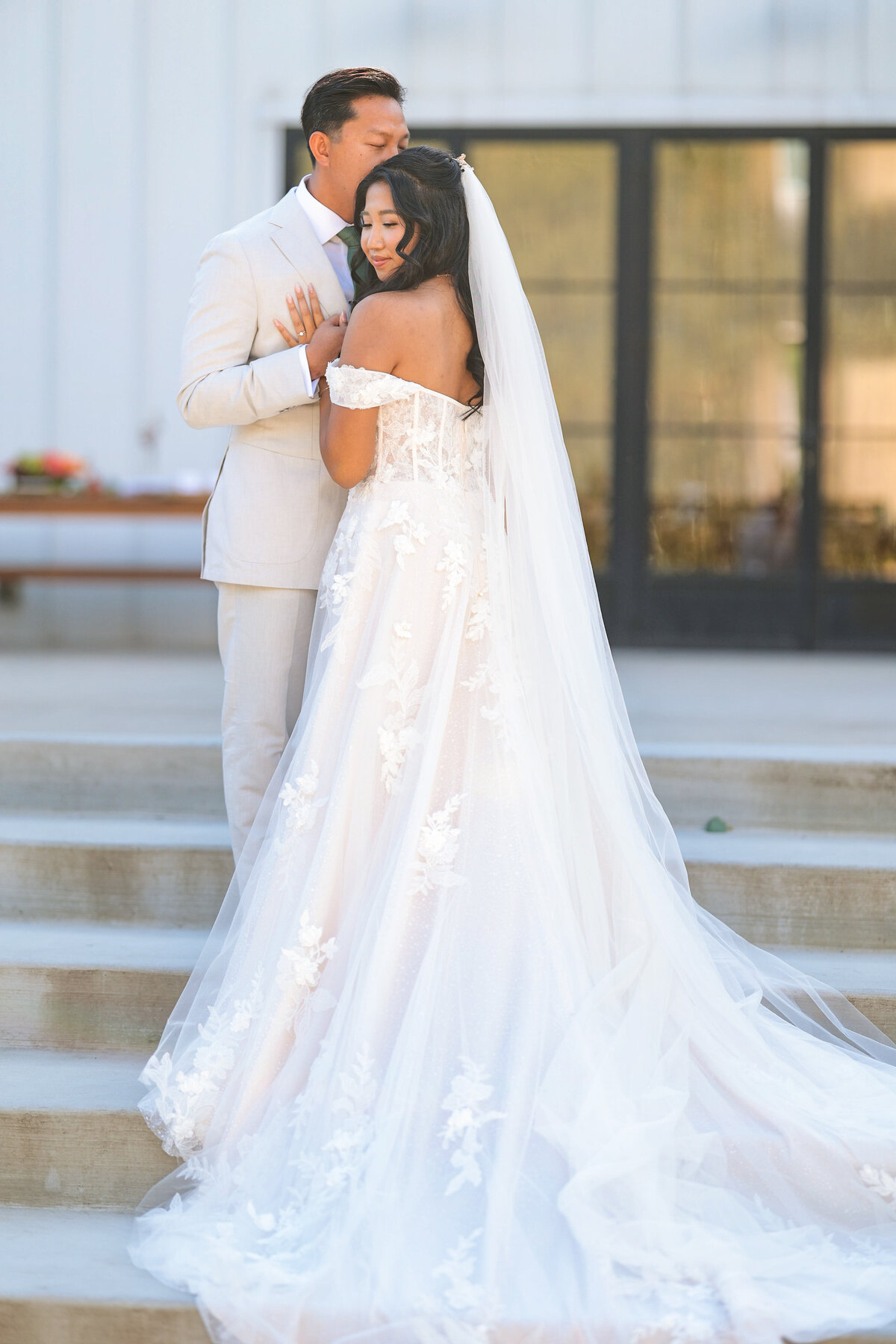 Sundrenched couple portrait at Barn South with bride in beautiful flowing gown.  