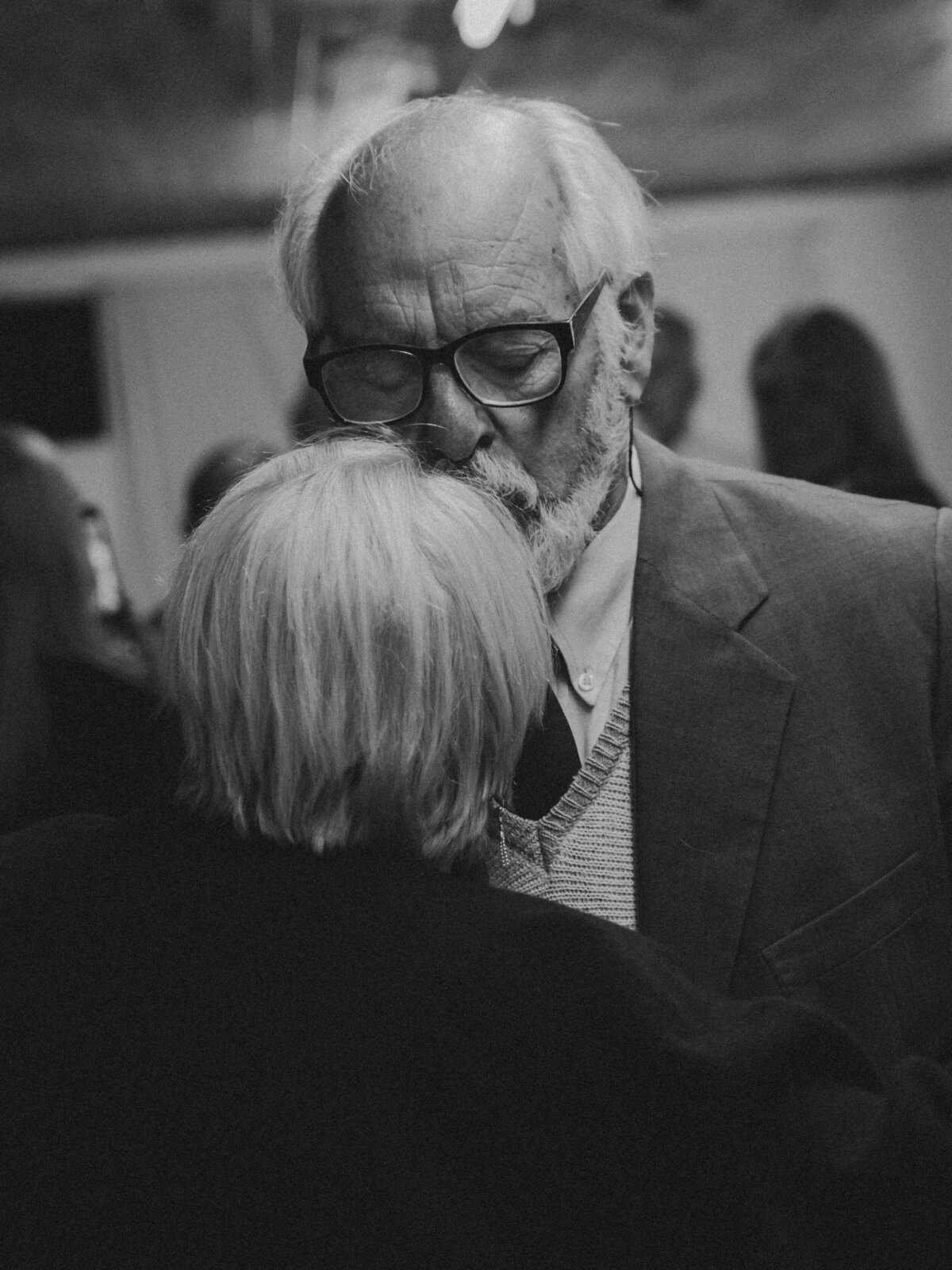 Older couple dance and kiss deeply loving