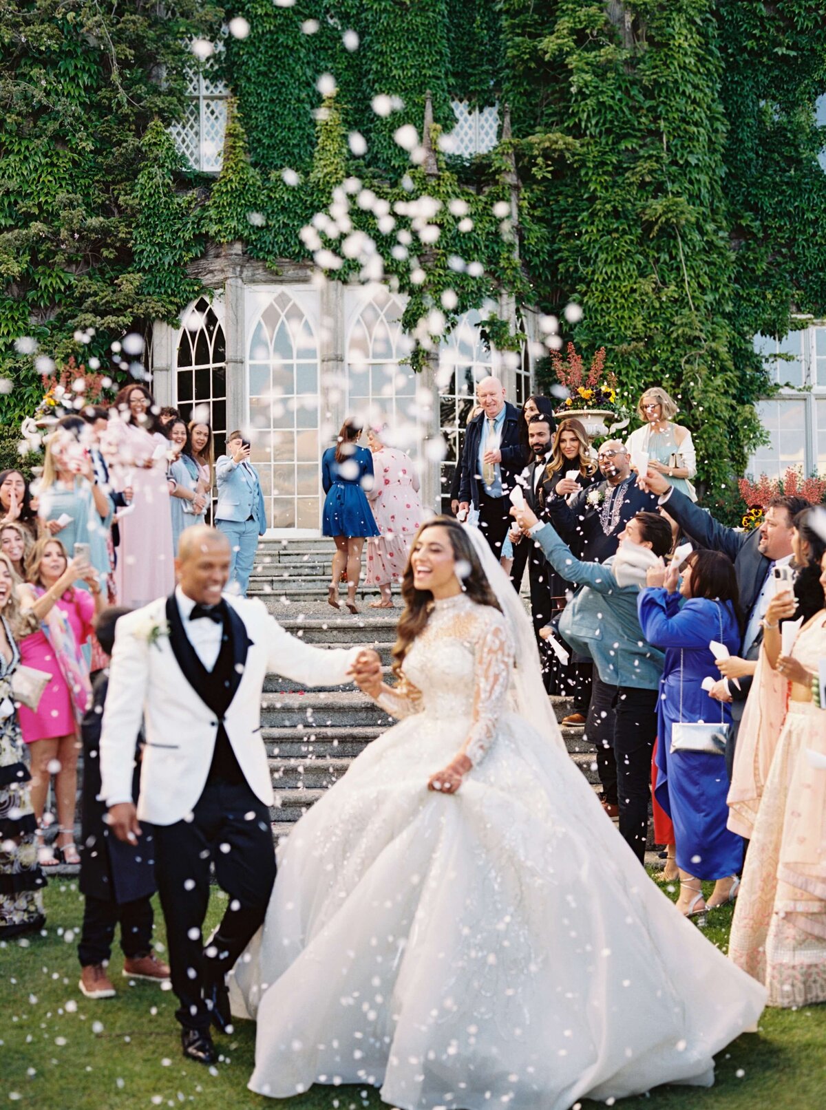 a wedding photo of the bride and groom in front of Luttrellstown Castle in Ireland