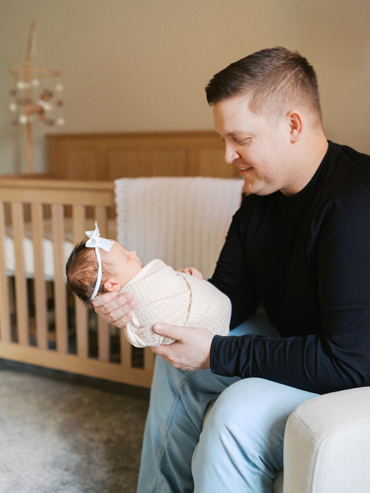 father-holding-newborn-baby