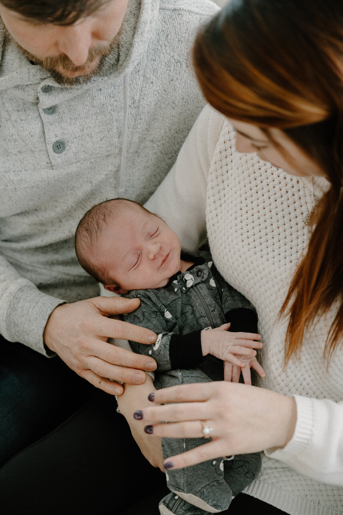 couple holding baby