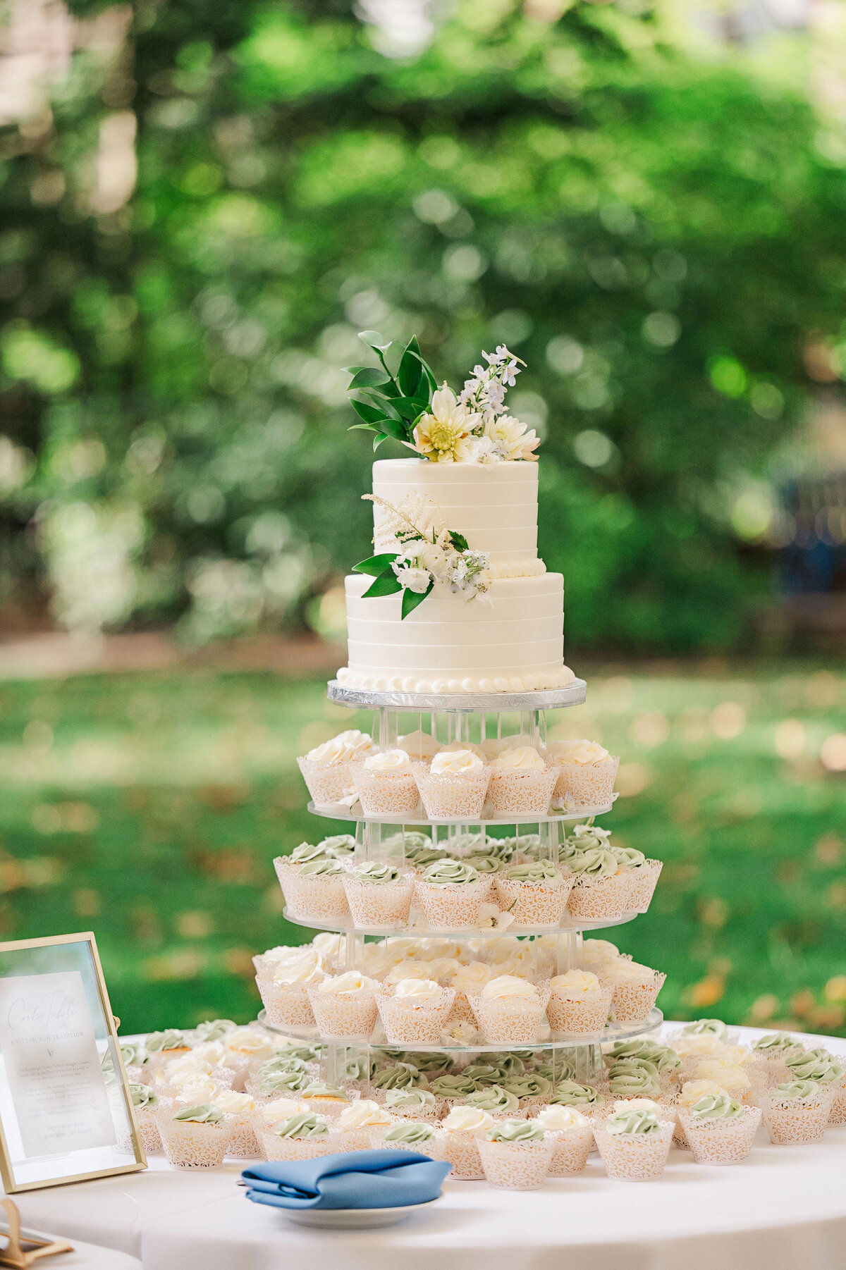 wedding cake and cupcakes