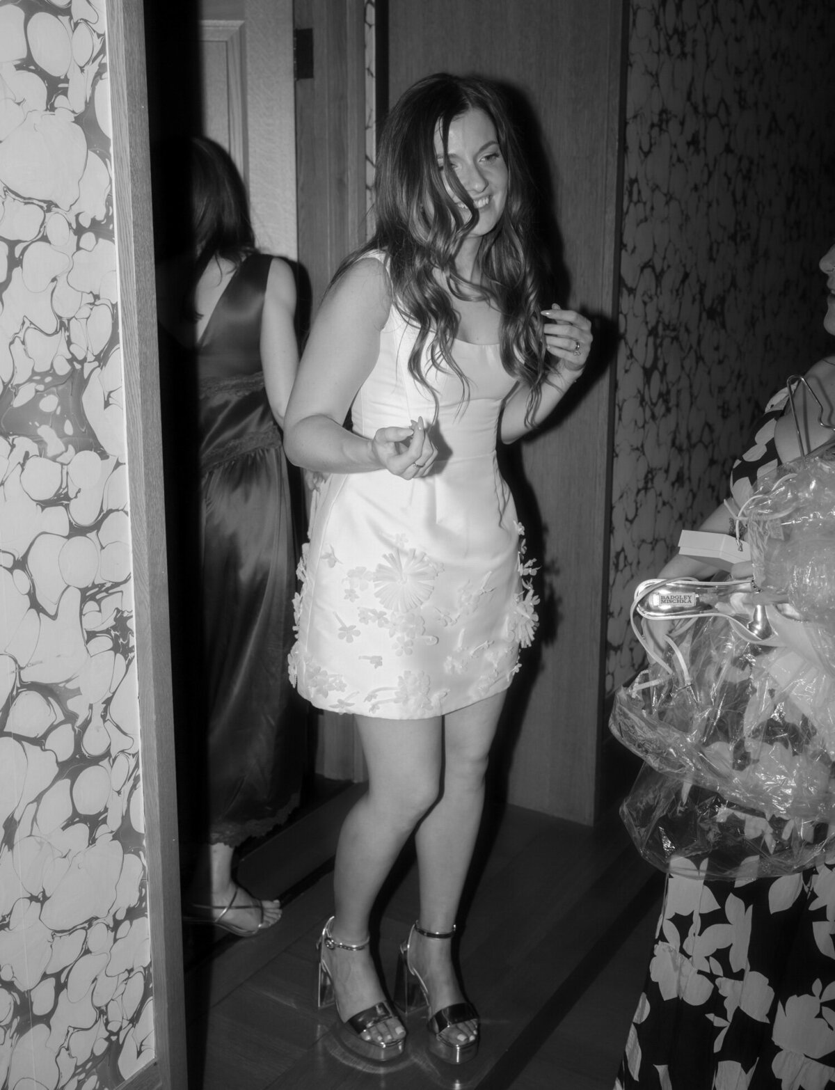 a bride shows off her second look wedding reception dress at Shinola Hotel
