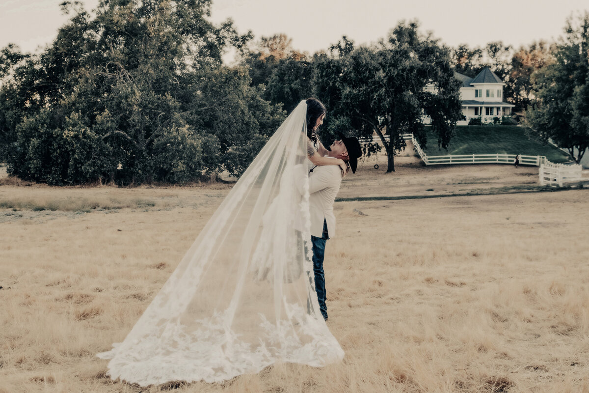groom lifting bride