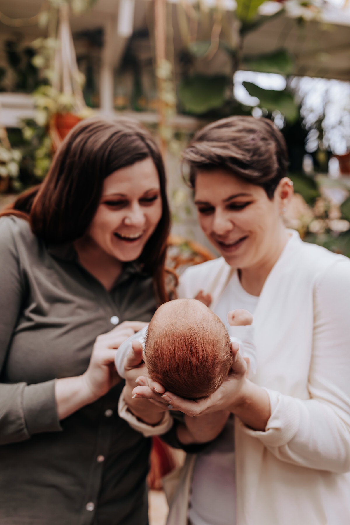 Nashville newborn photographer captures mothers holding baby and smiling