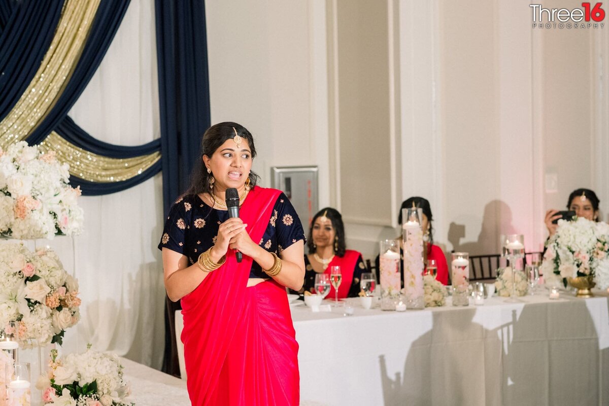 Maid of Honor toasts the Bride and Groom with a speech
