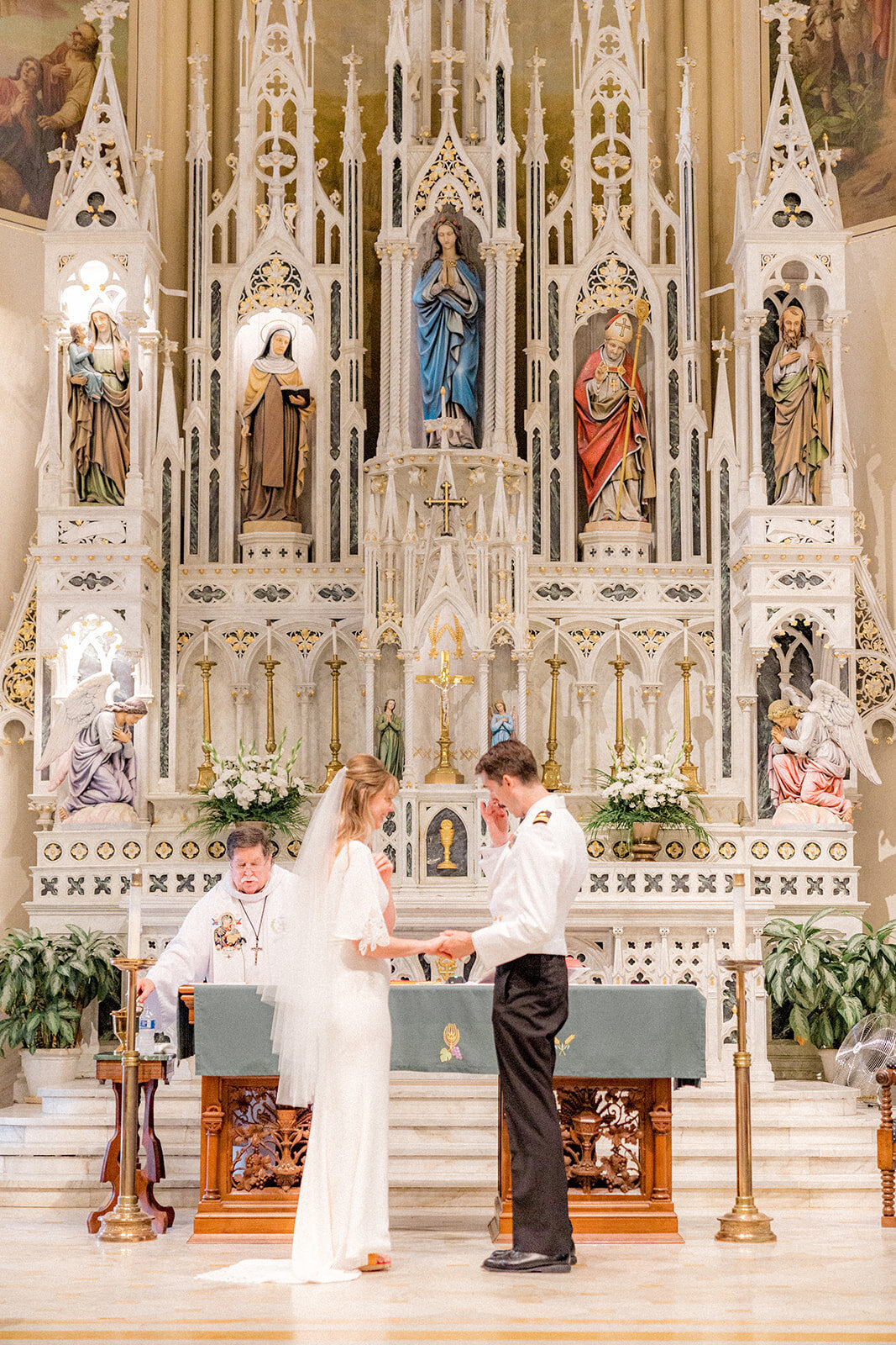 Bride and groom at chapel alter