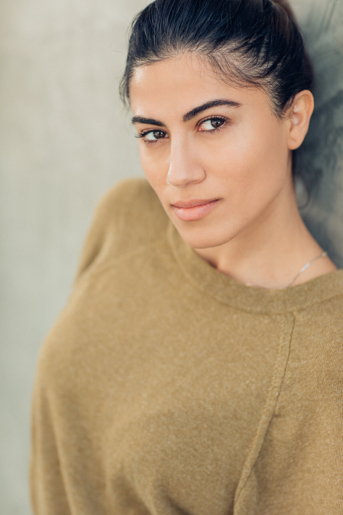 Headshot Photograph Of Young Woman In Green Sweater Los Angeles