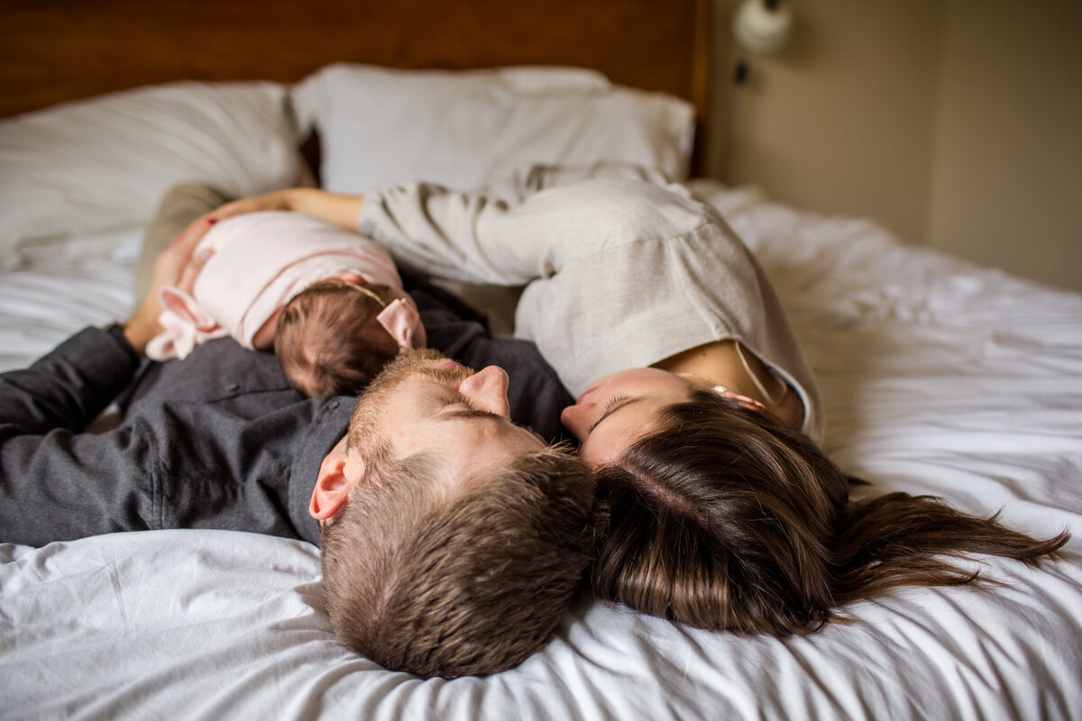 Natural light falling upon the bed at a newborn family photoshoot.