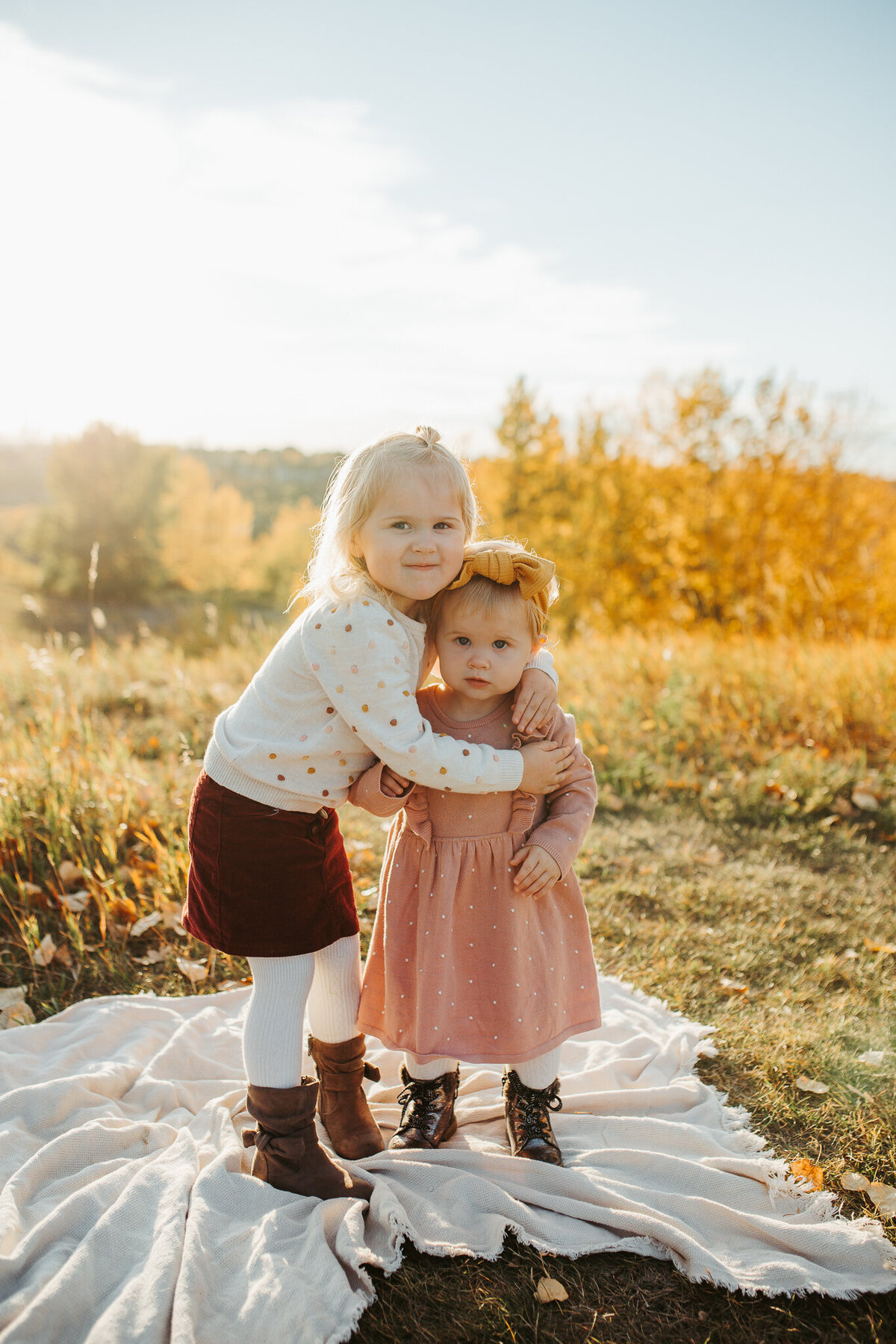 sisters hugging during edmonton family session
