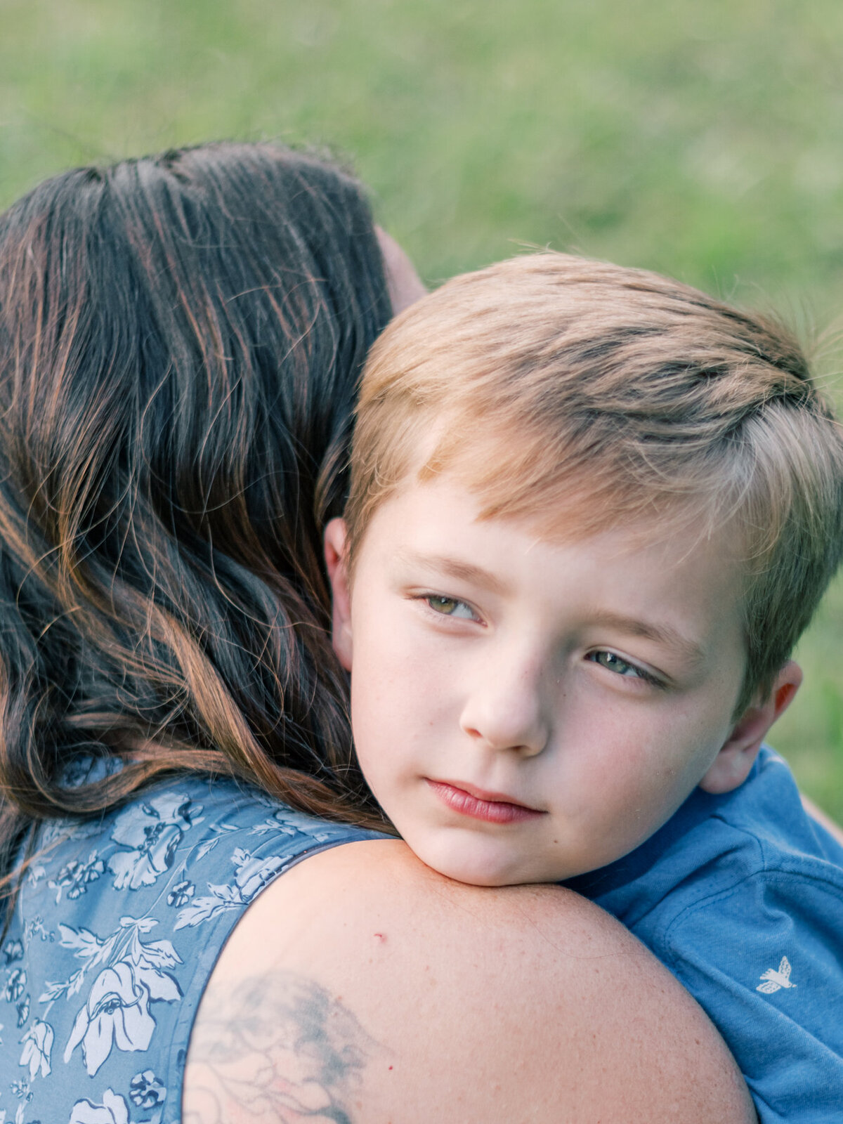 Close up of young son hugging his Mom.