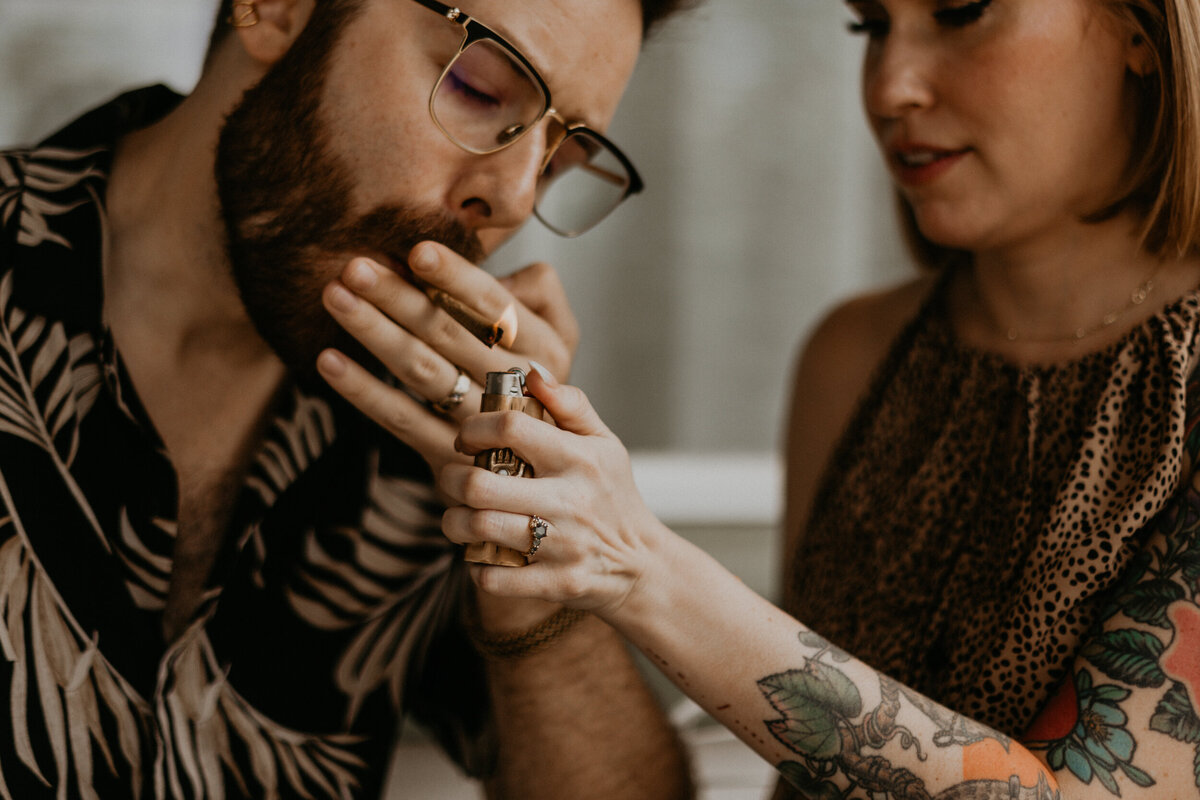 420 friendly couple smoking a joint together