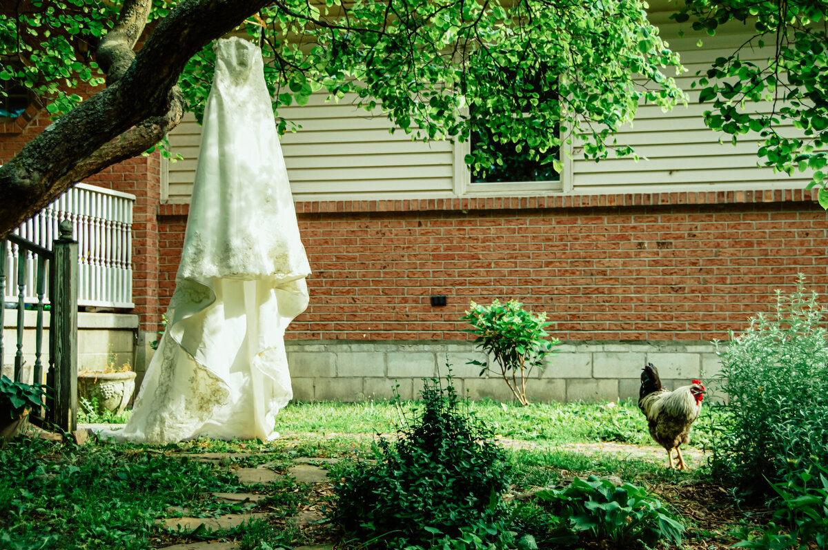 Toledo bride hangs dress before outdoor wedding