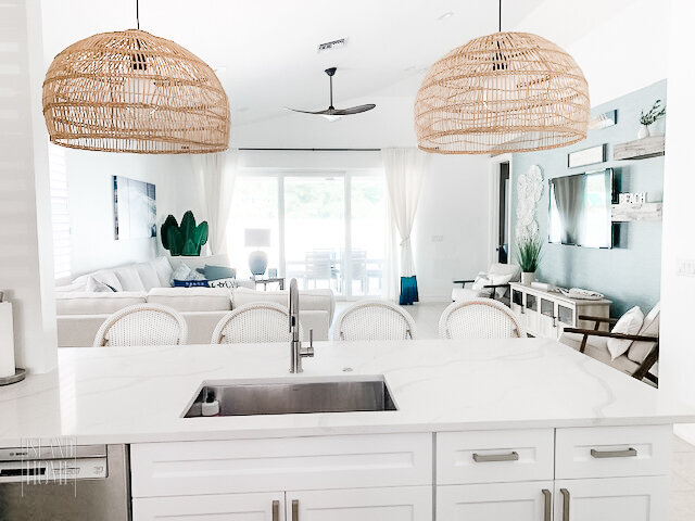 Island Home Interiors coastal kitchen pendant lights rental Distance Design Lake Nona