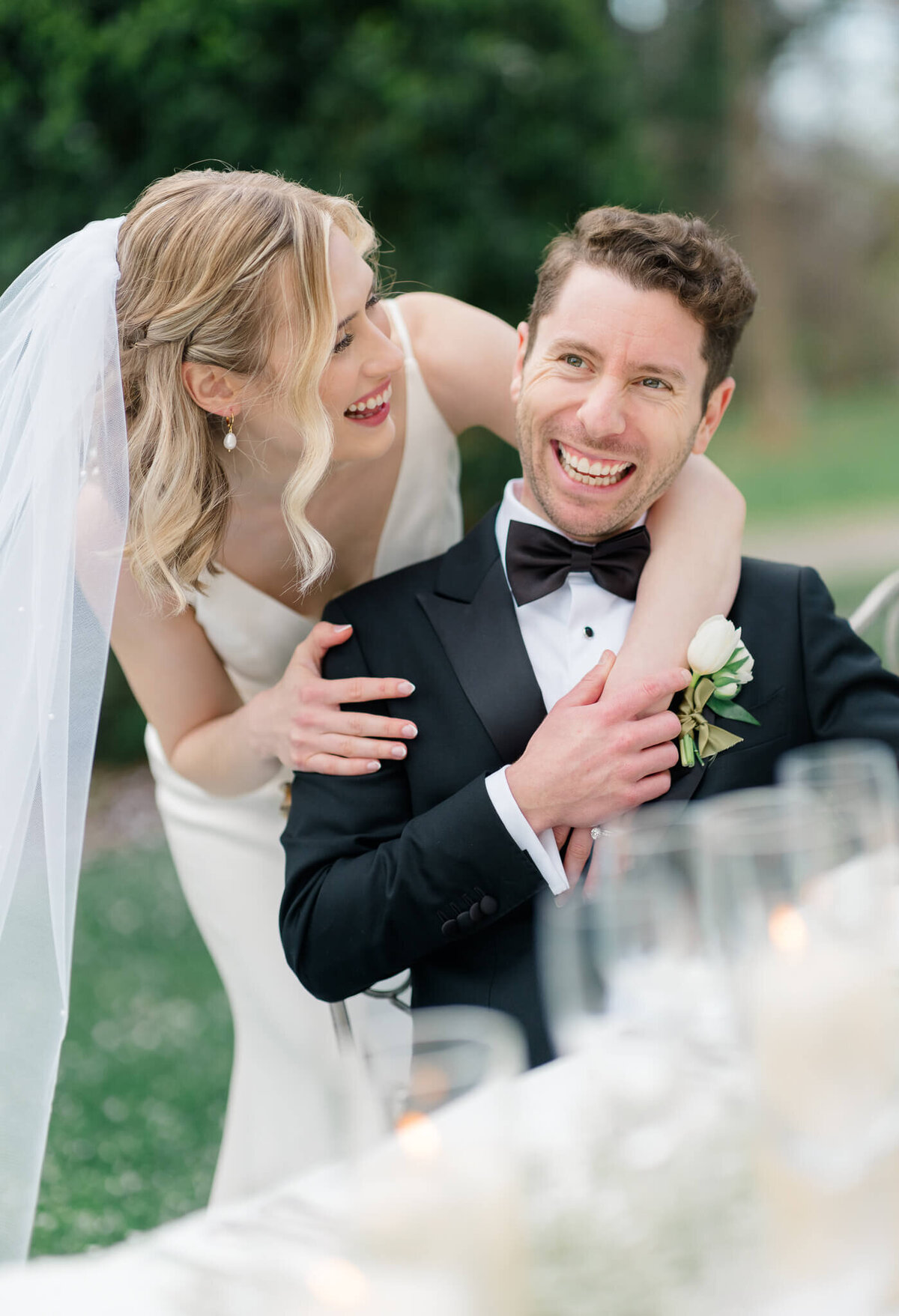 Bride and groom laughing during speeches at The Market at Grelen in Somerset, Virginia. Captured by Washington DC Wedding Photographer Bethany Aubre Photography.