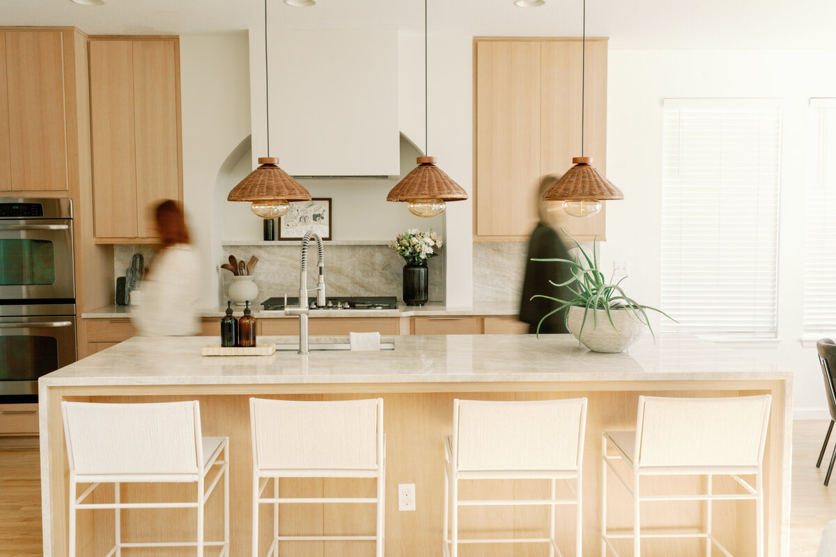 Mixed wood tones and metals are the star in this Erie Colorado home.  Kitchen and bath remodel specialist.
