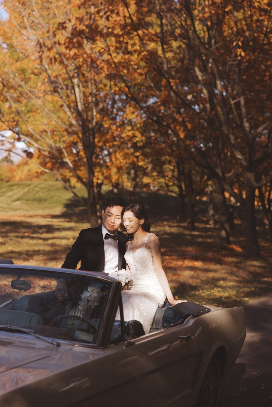 Autumn wedding shoot at Millbrook, Arrowtown. Vintage car & helicopter.