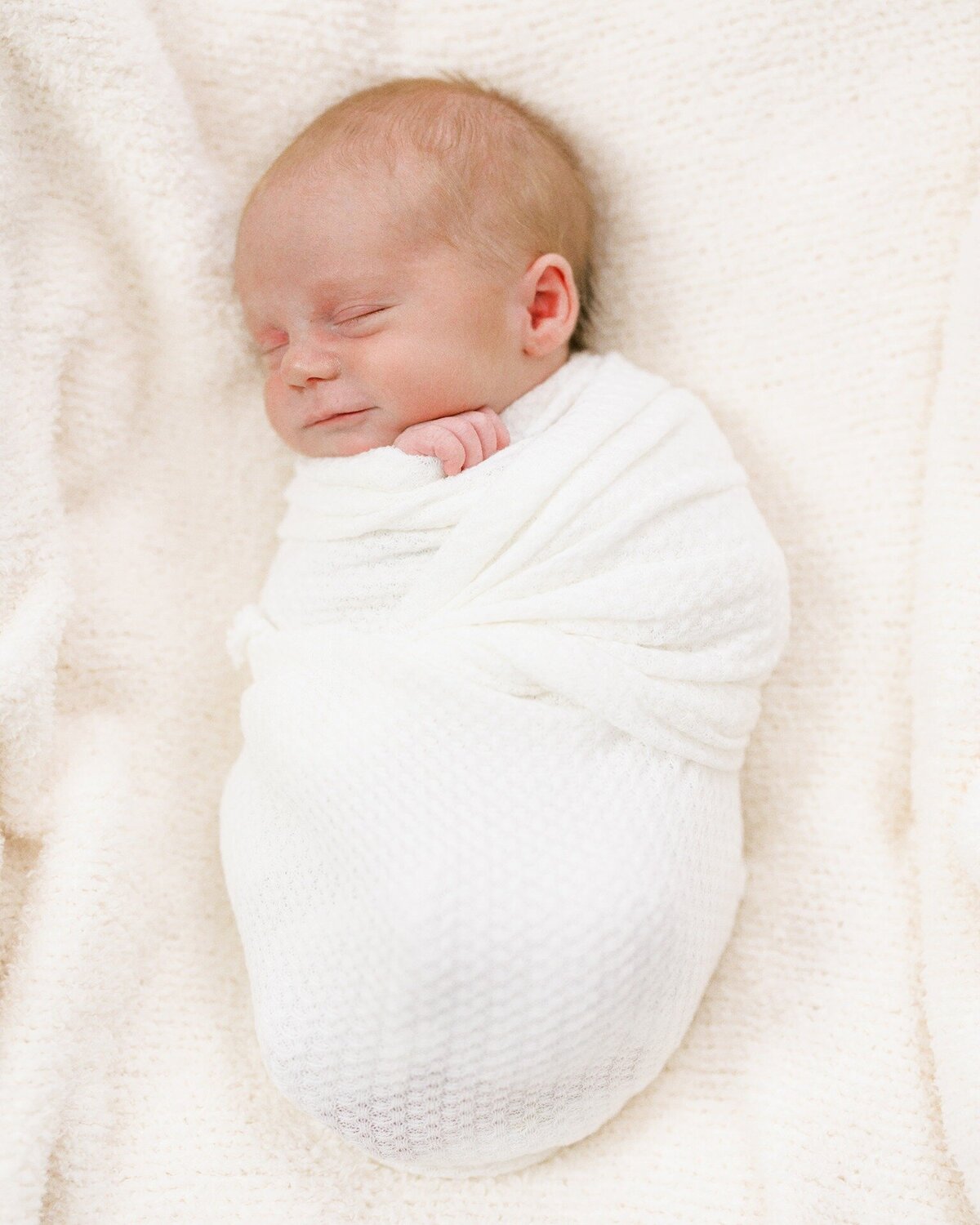 newborn-baby-wrapped-in-blanket