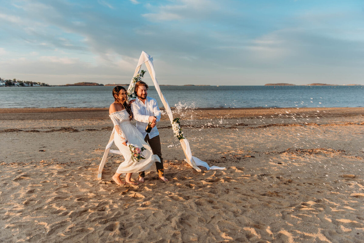 Wollaston Beach Elopement - champagne spray